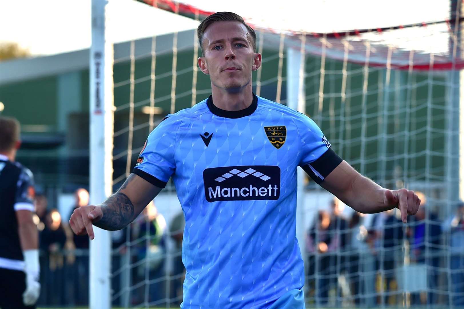 Sam Corne celebrates after scoring Maidstone's second at Woodside Road. Picture: Steve Terrell