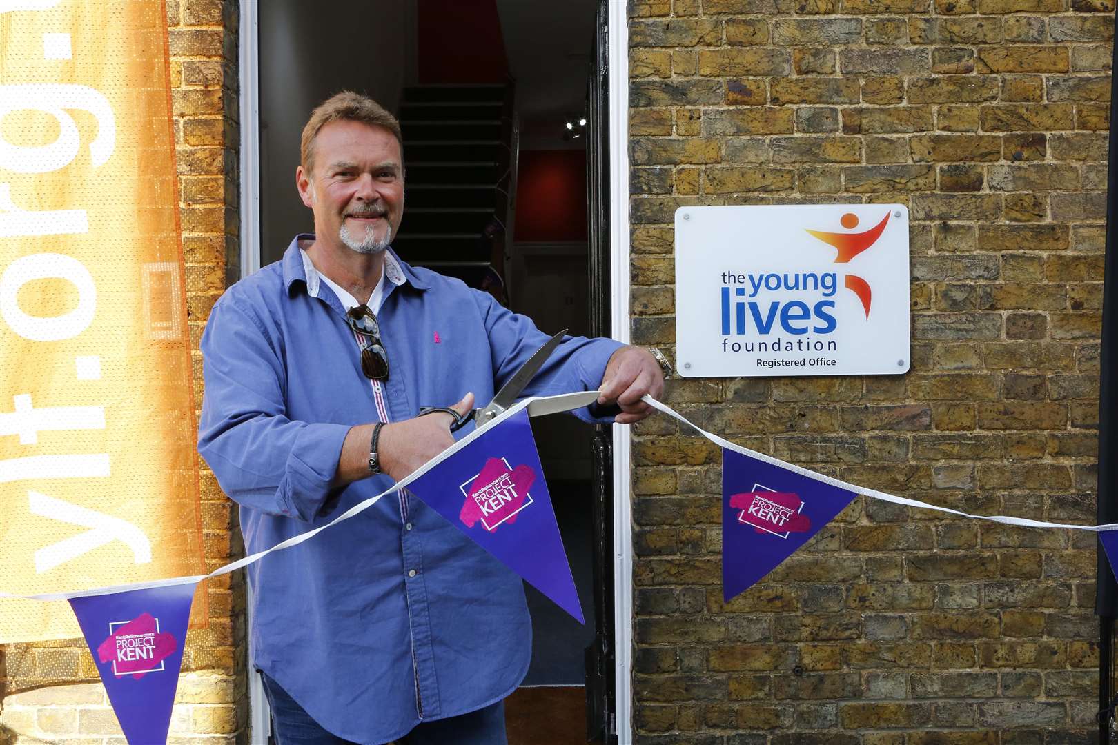 Project Kent's Grand Opening! kmfm's Project Kent with Kent Reliance. Andy Golding from Kent Relliance cuts the ribbon at Young Lives Foundation .Picture: Andy Jones (4165019)