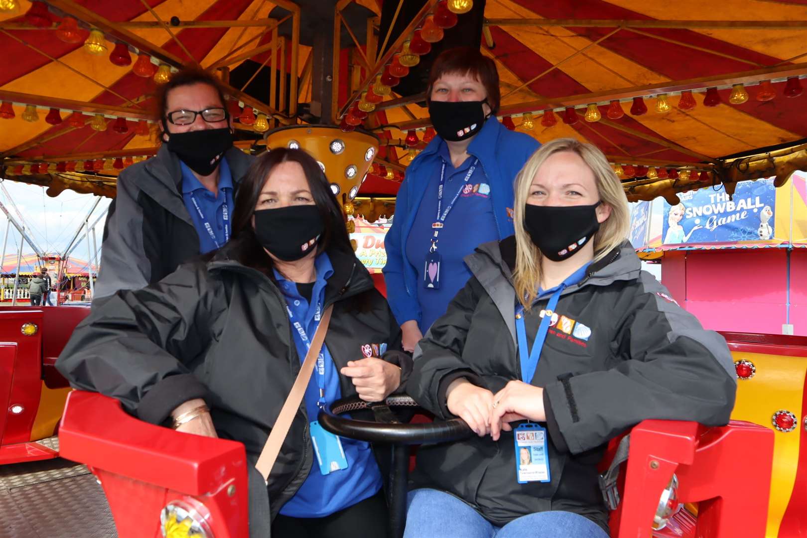 The Seashells crew with Kate Townsend-Blazier grab a ride on the tea cups at Smith's Funfair at Barton's Point, Sheerness