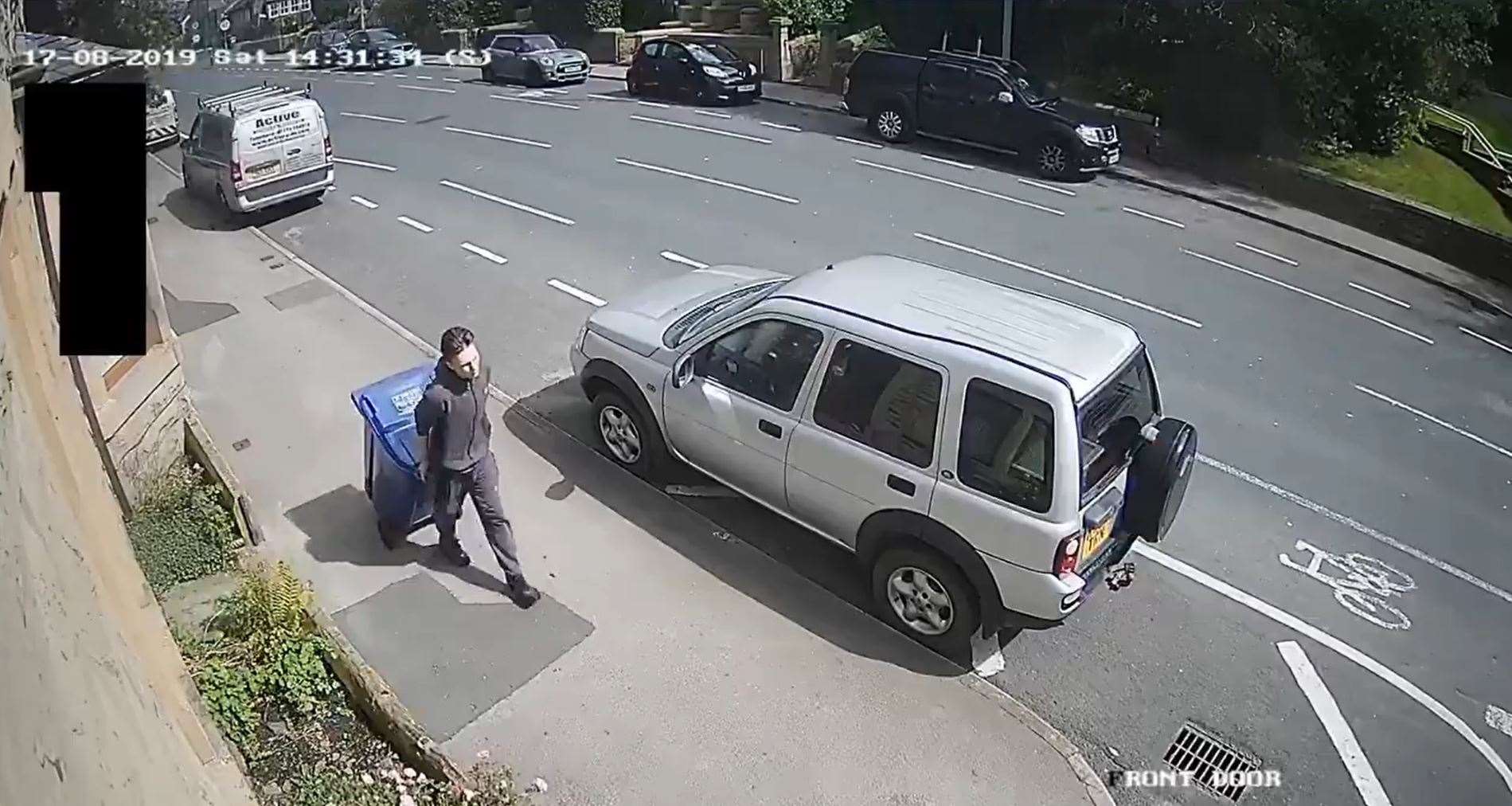 A screengrab from CCTV of Price moving the body of Lindsay Birbeck in a wheelie bin (Lancashire Constabulary/PA)