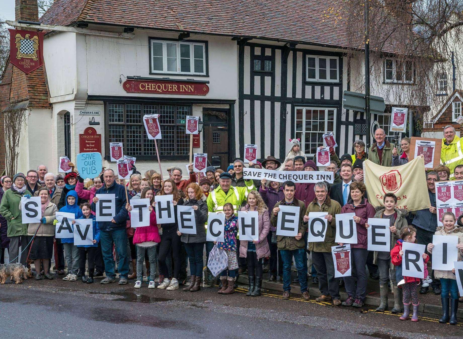 The continuing campaign to save the Chequer Inn. Demonstrators in 2016 when it was saved from housing. Picture courtesy of Matthew Titterton.