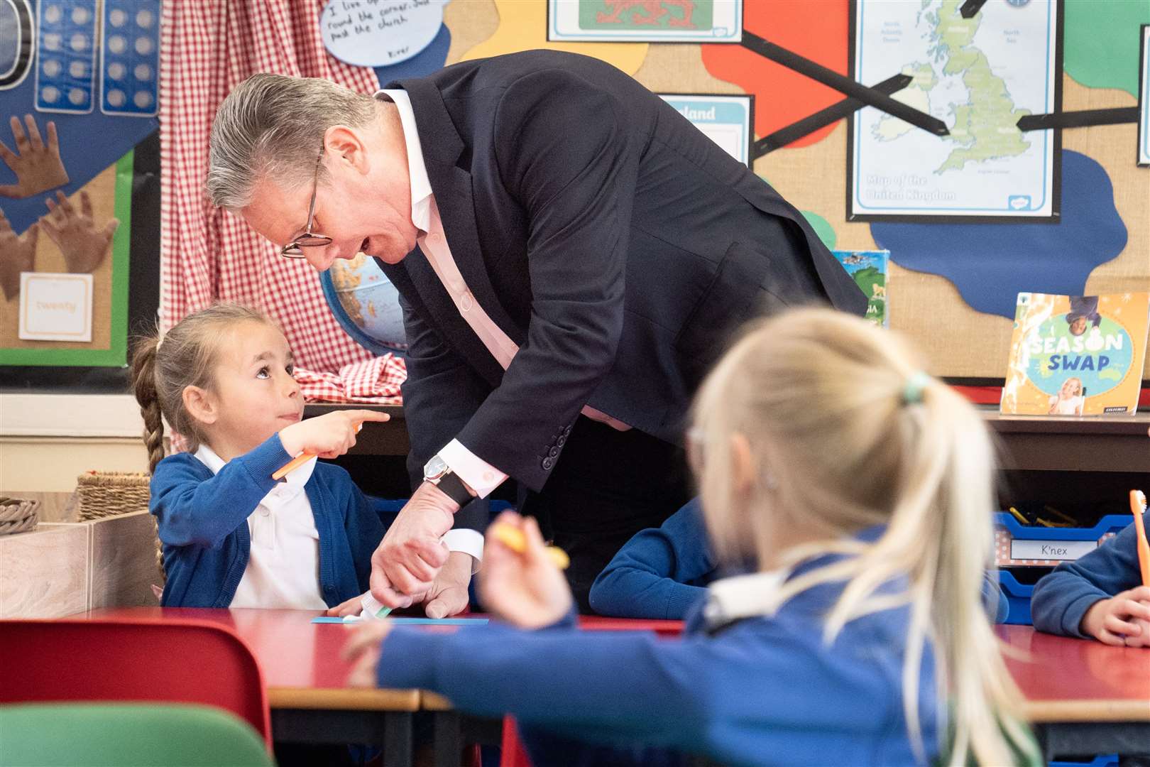 Brushing up on his people skills: Sir Keir helped the pupils during a lesson on oral hygiene, demonstrating the right amount of toothpaste to squeeze out (Stefan Rousseau/PA)