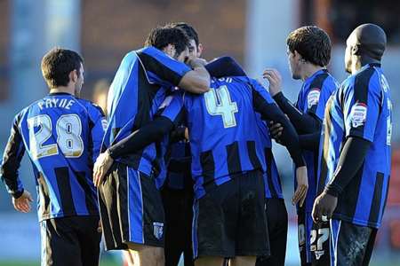 Gillingham players celebrate scoring the equaliser against Crewe