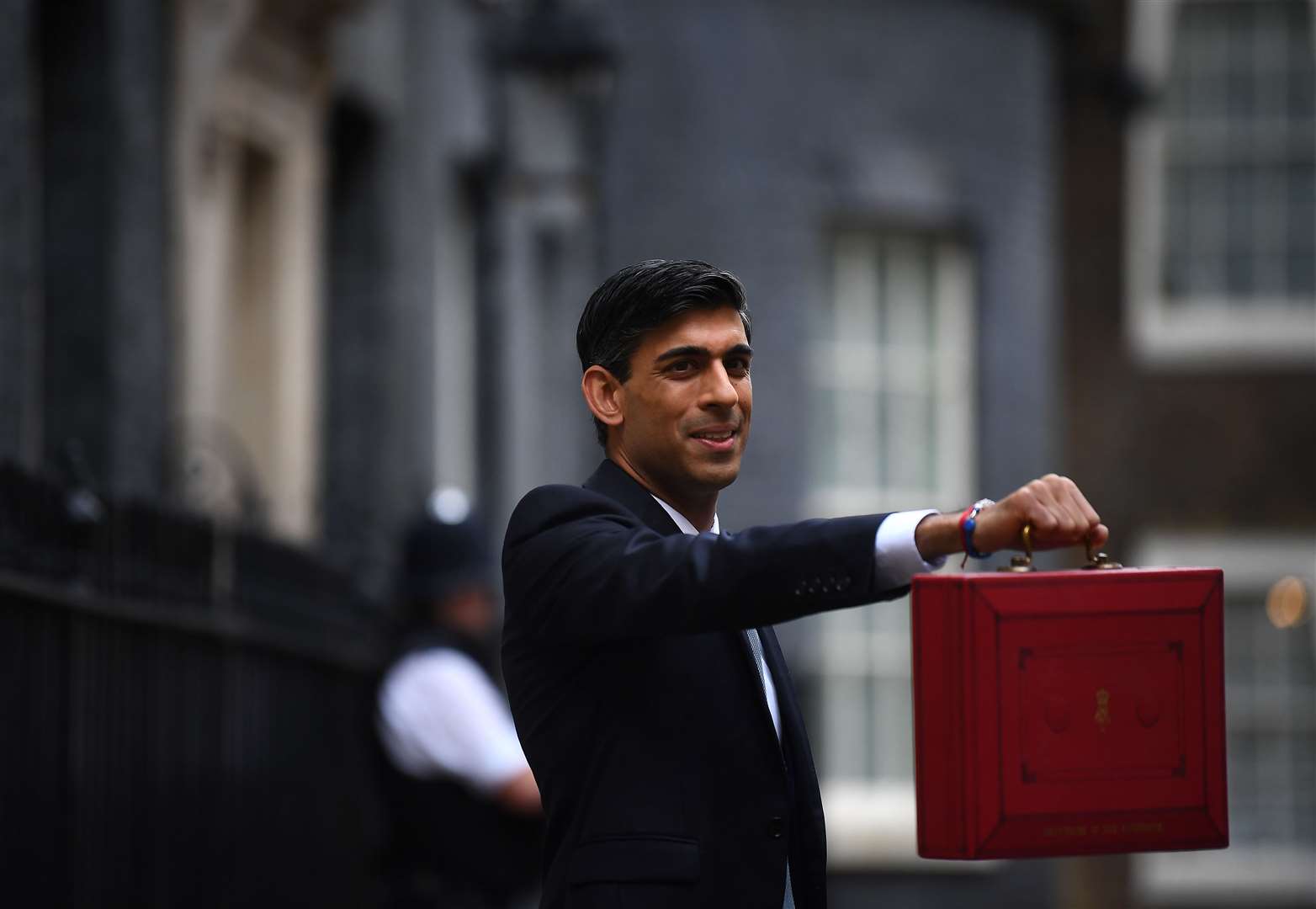 Chancellor Rishi Sunak outside 11 Downing Street, London, before heading to the House of Commons to deliver his Budget (Victoria Jones/PA)