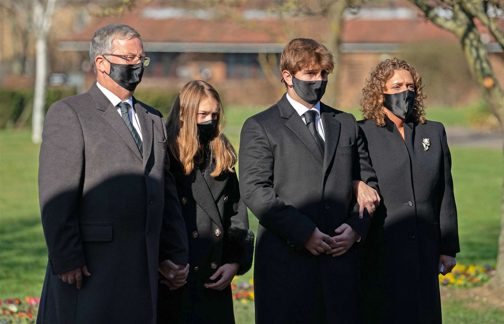 (l to r) Son-in-law Colin Ingram, granddaughter Georgia, grandson Benjie and daughter Hannah Ingram-Moore were among the mourners (Joe Giddens/PA)