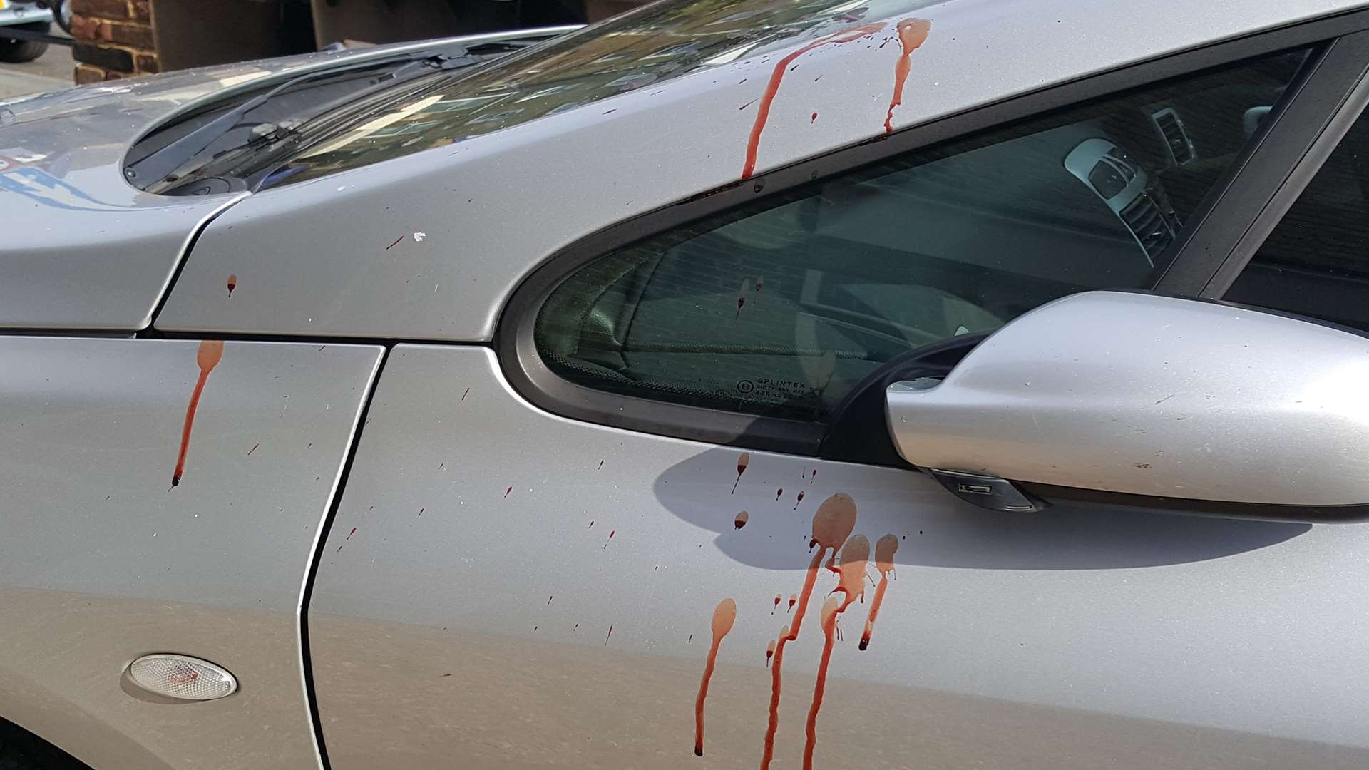 Blood on a nearby car