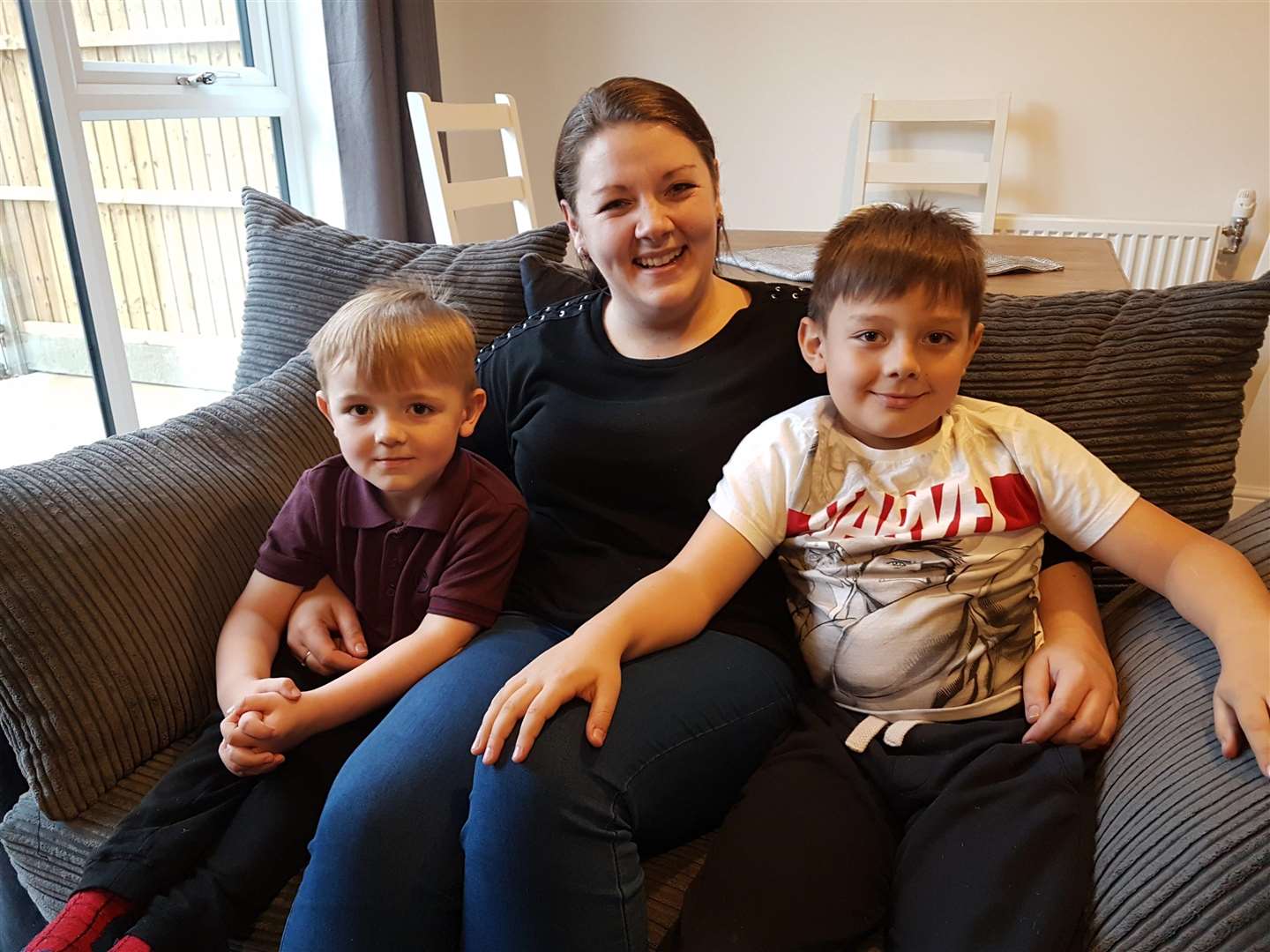 Lucy Marshall, one of the new residents, with her sons