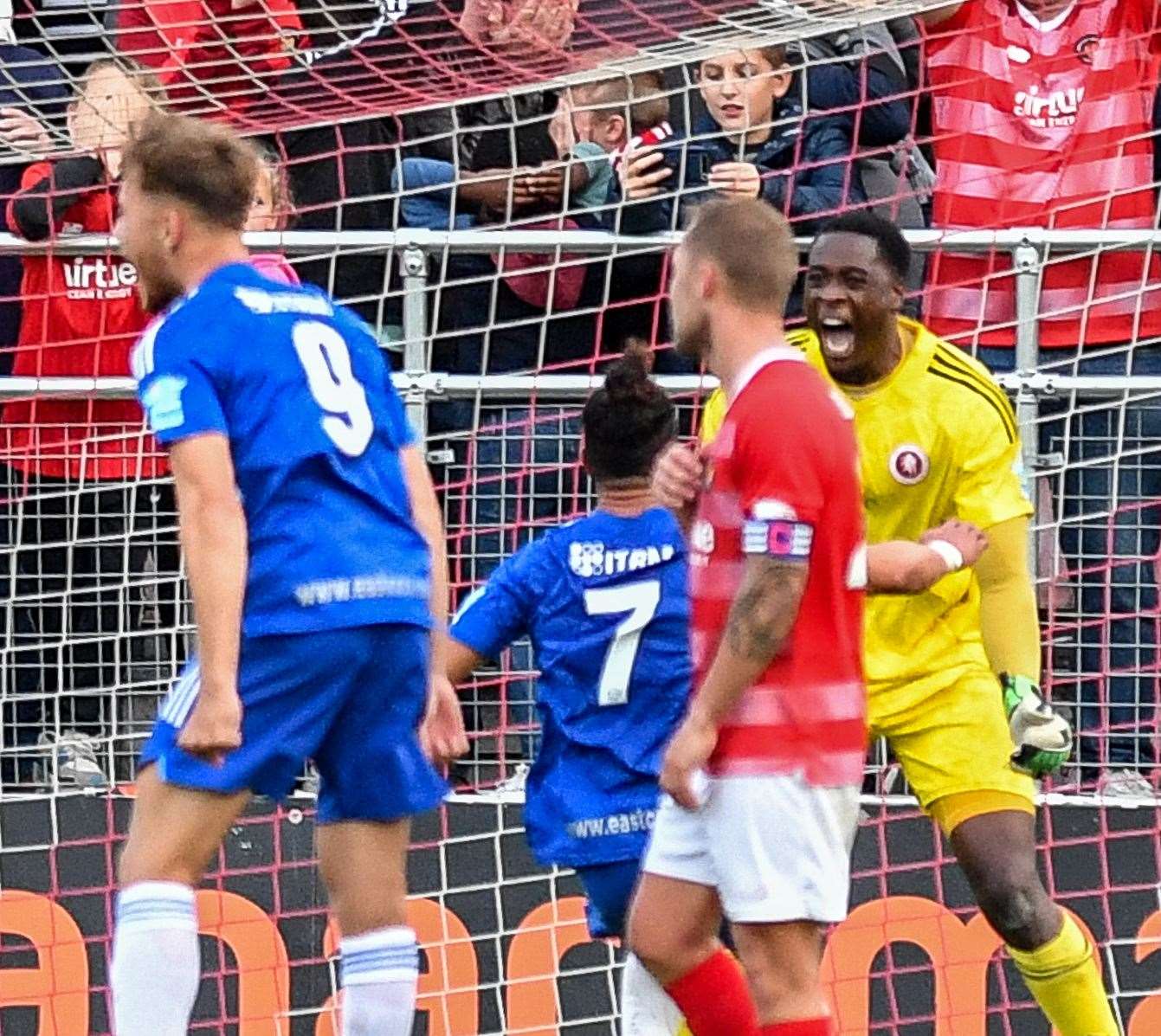 Welling keeper Kai Mckenzie-Lyle celebrates his late penalty save. Picture: Dave Budden