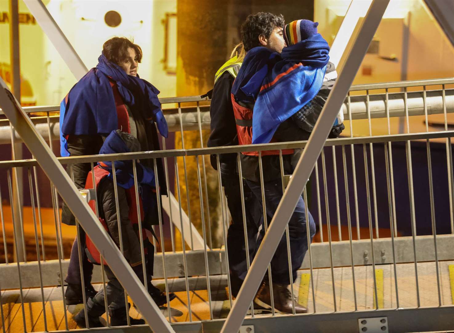 Two children with a man and woman among the group arriving at Dover. Picture UKNIP