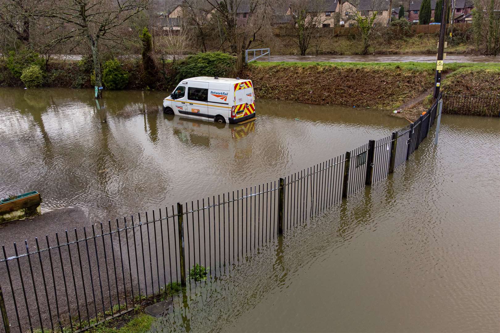 A van was trapped by water next to the River Taff in Taffs Well, Wales, this week (Ben Birchall/PA)