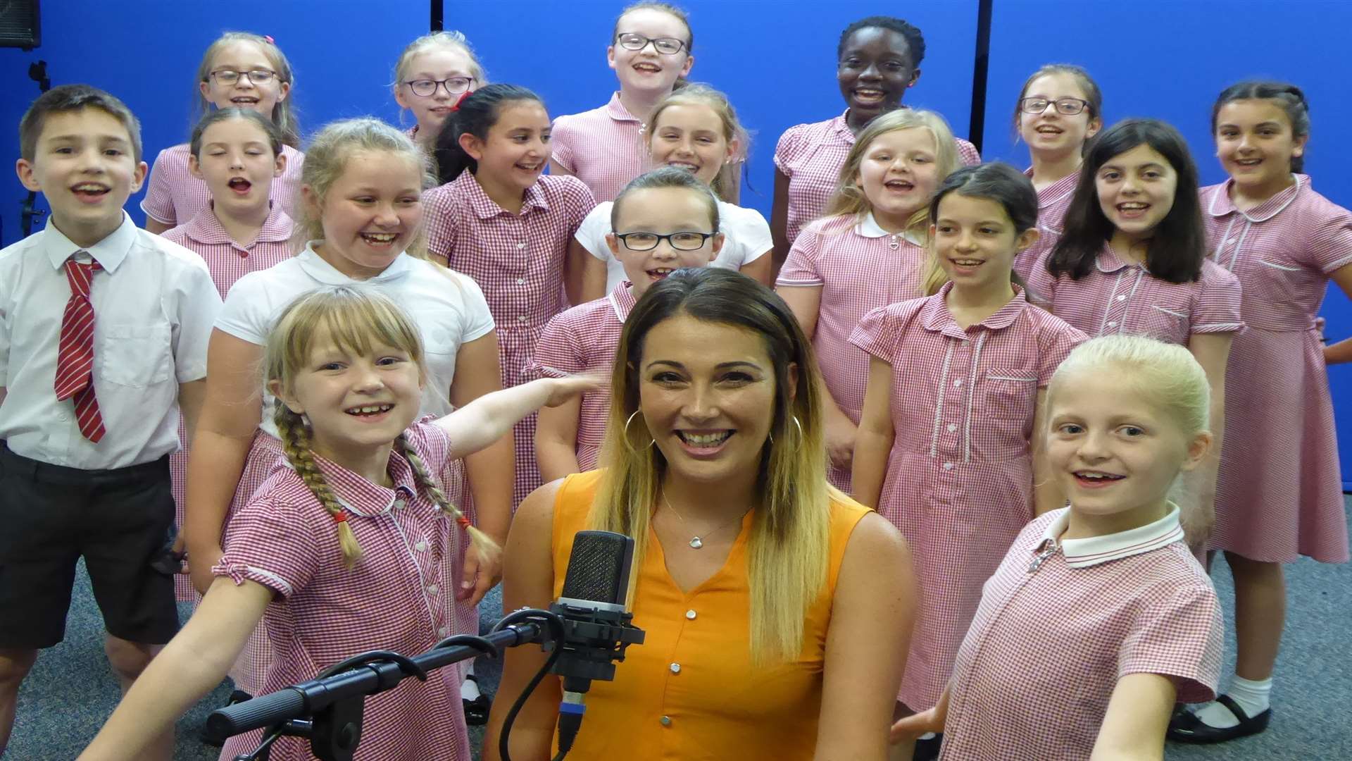 Walderslade Primary School choir were named as winners in the 2017 Walk to School Song Contest. Pictured is contest judge Leah Macdonald of 3R's teacher recruitment and Emma Dorrell and Ella Petchey, both eight.