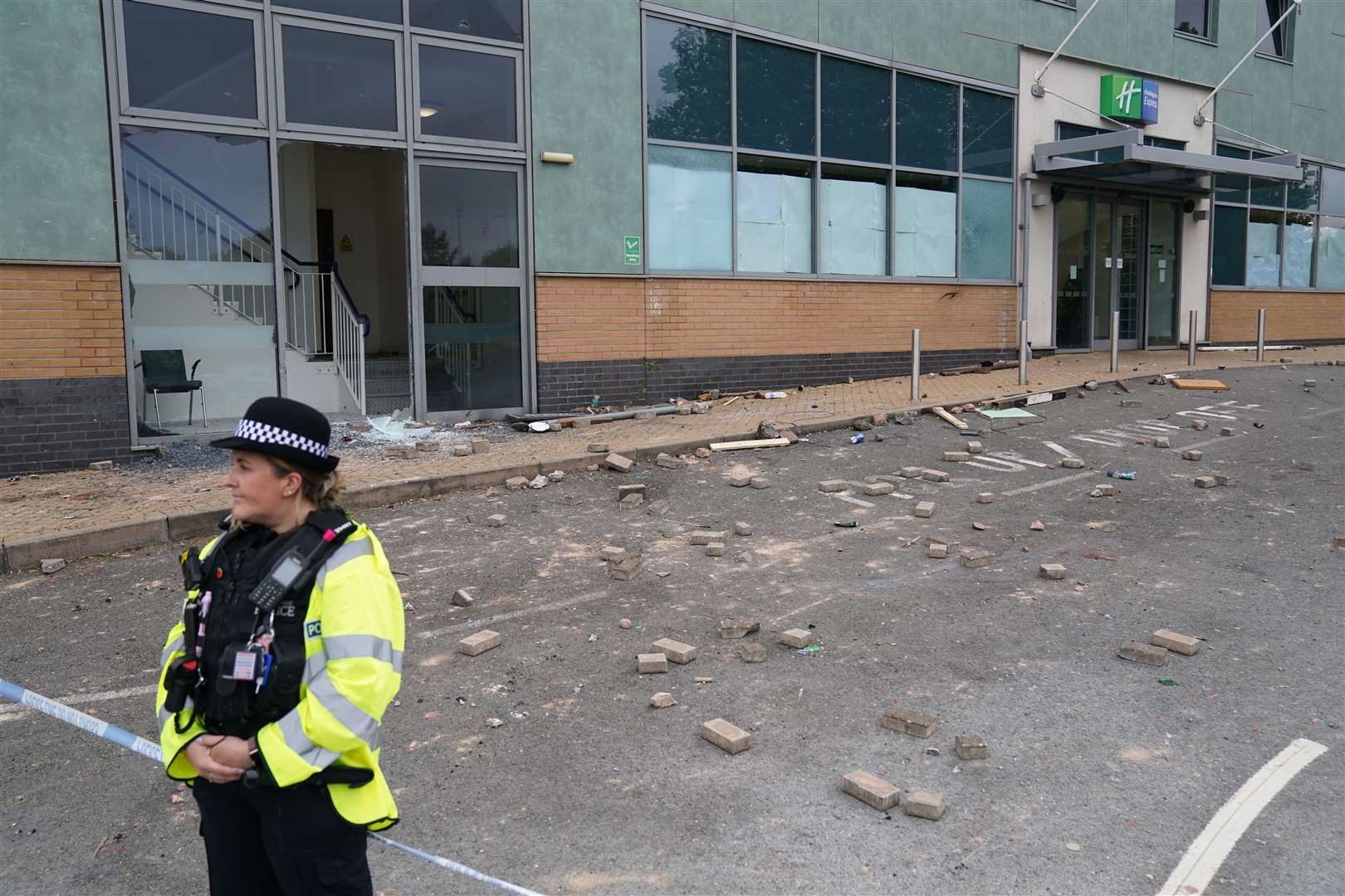 Police guarding the Holiday Inn Express in Tamworth a day after it was attacked (Jacob King/PA)