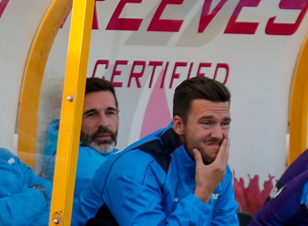 Paul Booth, left, watches from the dugout on Saturday Picture: Matthew Walker