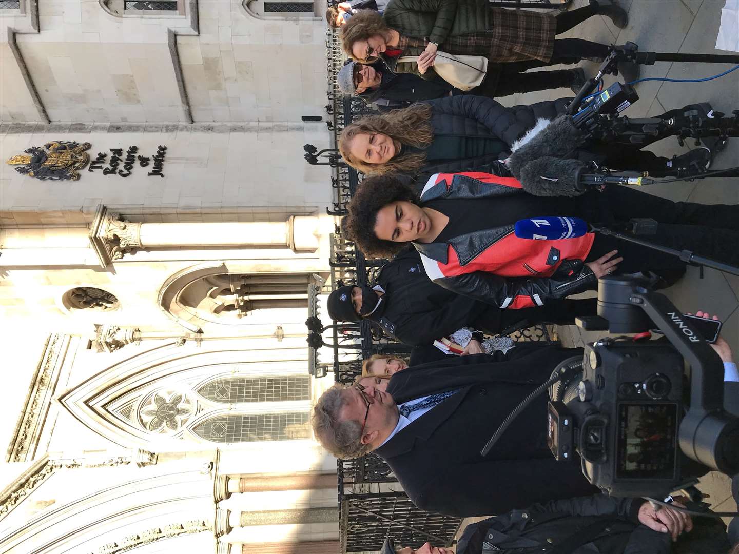 Keira Bell, centre, speaking outside the Royal Courts of Justice in London after a landmark High Court ruling on whether children can consent to puberty blockers (PA/Sam Tobin)