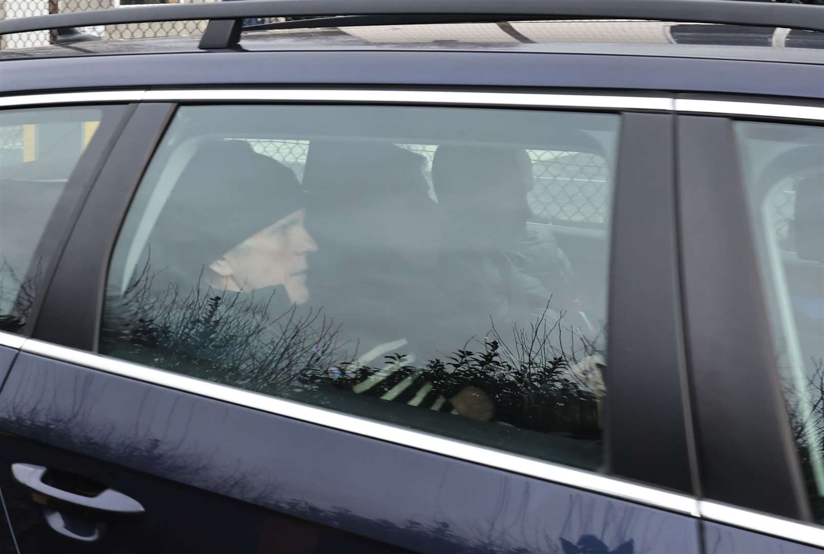 From left, Natalie McNally’s father Noel, mother Bernie and brother Declan are driven away from Lisburn Courthouse (Liam McBurney/PA)