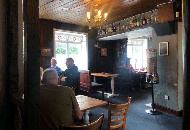 This is a Grade II listed building and the dark wooden boards across the ceiling make is fairly dark inside the pub