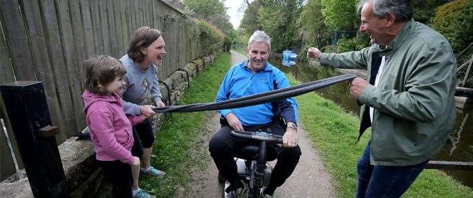 Mr Igglesden completes the challenge. He is cheered on by his family and Mr Potter.. Picture: Professional Cricketers' Trust