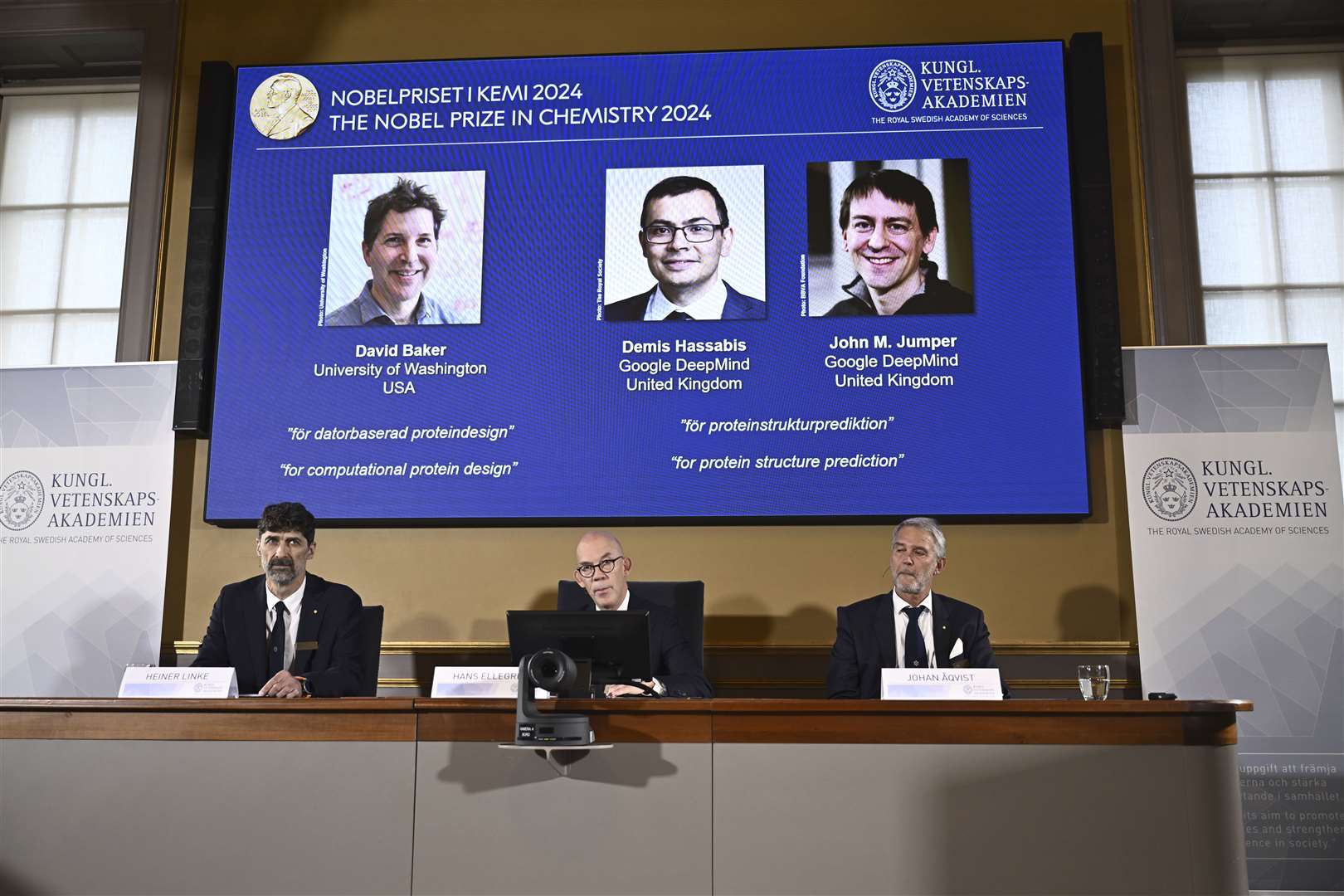 Johan Aqvist, Hans Ellegren and Heiner Linke, of the Nobel Committee for Chemistry, award this year’s prize to David Baker, Sir Demis Hassabis and John Jumper (Christine Olsson/AP)