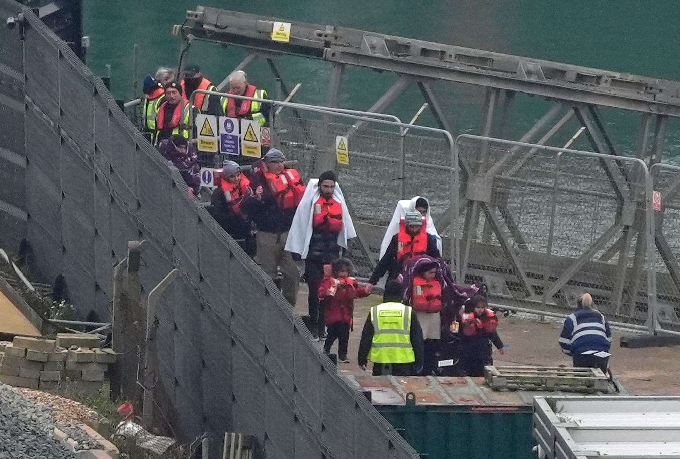 A group of people thought to be migrants, including young children, are brought in to Dover on Friday (Gareth Fuller/PA)