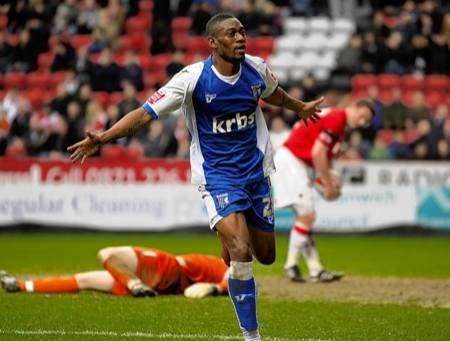 Dennis Oli celebrates his strike against Charlton at The Valley.