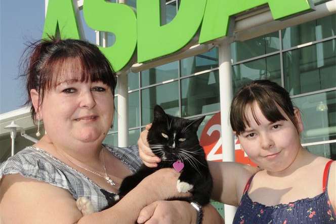 Daisy with owners Nicki Wright and daughter Megan outside Asda