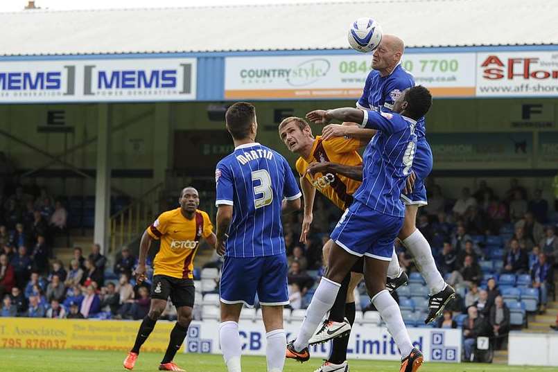 Gills skipper Adam Barrett wins the ball Picture: Barry Goodwin