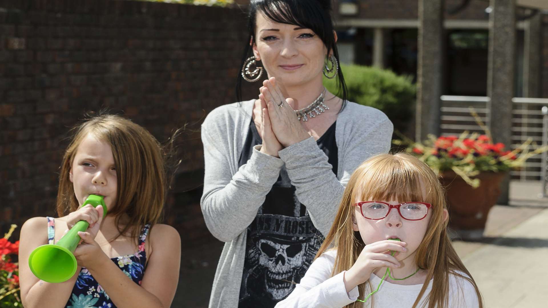 Siobhan Mclaughlan, with Lucy Tindall, and Skyla McLaughlan, protesting outside Medway Council