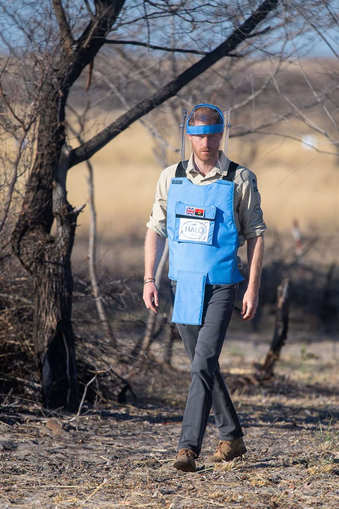 The Duke of Sussex walks through a minefield in Dirico, Angola, during a visit to see the work of landmine clearance charity the Halo Trust in 2019 (Dominic Lipinski/PA)