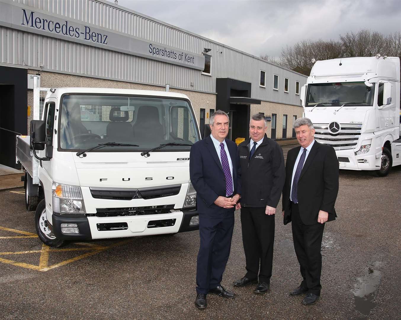 Sparshatts' new owners dealer principal Steve Rooney, right, his brother Paul, centre, and Peter Davies