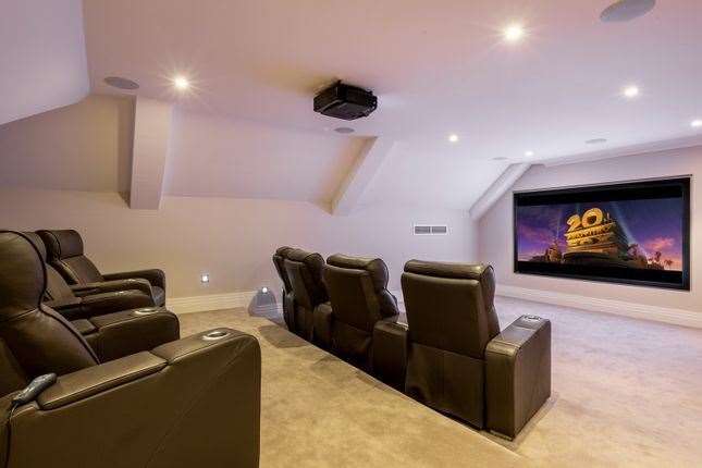 The house comes with its own cinema. Picture: Zoopla / Maison