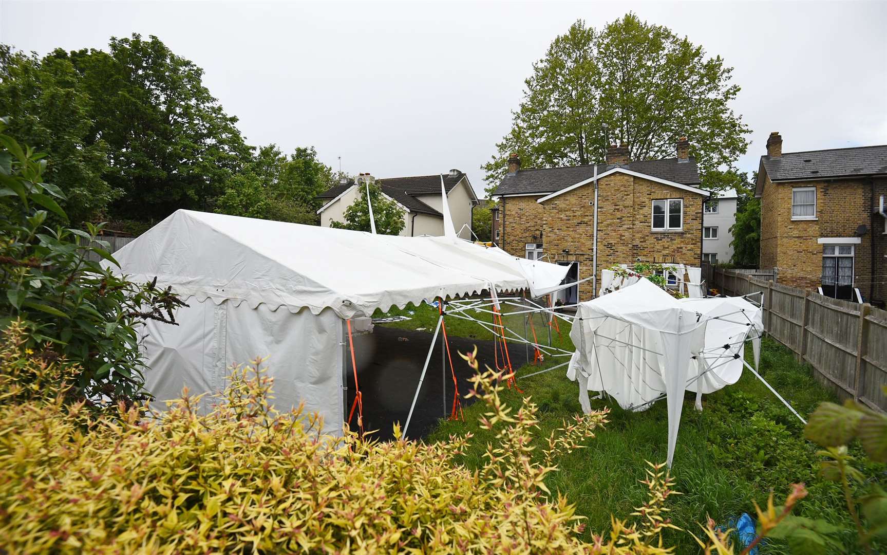 A tent in the garden of a house in Consort Road, Peckham, police officers investigating the shooting of black equal rights activist Sasha Johnson (Kirsty O’Connor/PA)