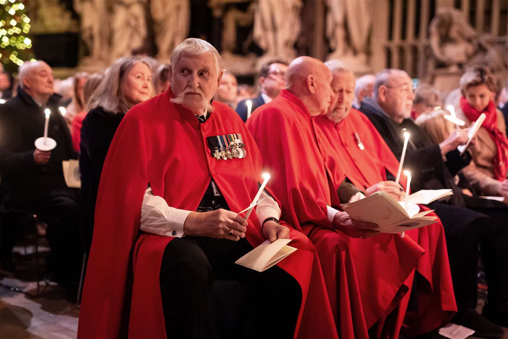 Chelsea Pensioners in their red cloaks and medals were part of the audience (PA)