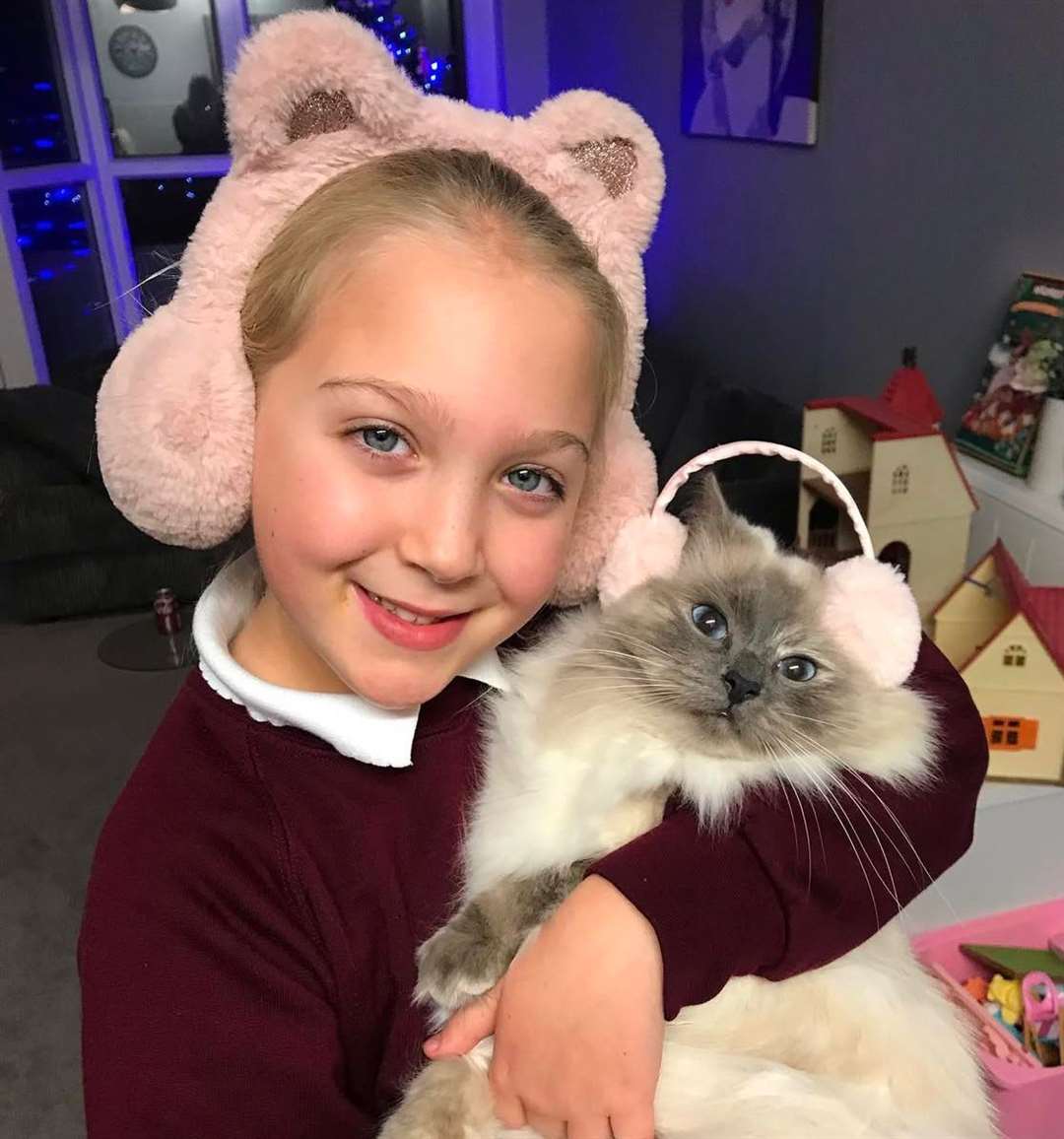 Scarlet, 11, with her cat named Winter. Picture: Nicola Garrett