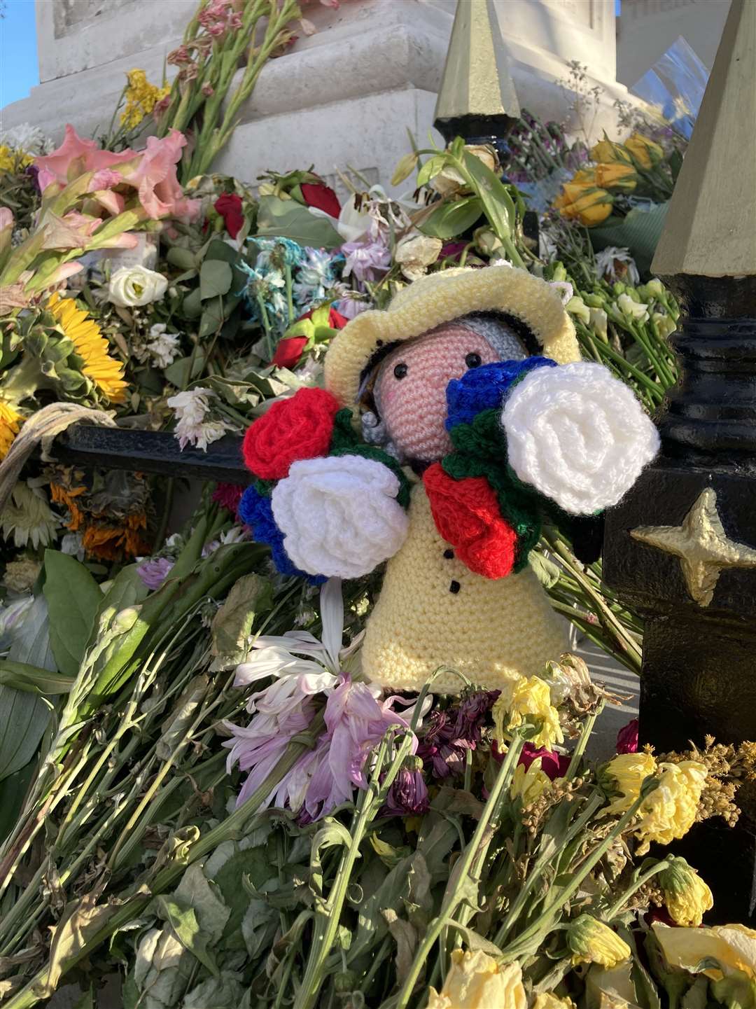 Floral tributes left at the base of the war memorial in Sheerness to mark the death of The Queen. Picture: John Nurden