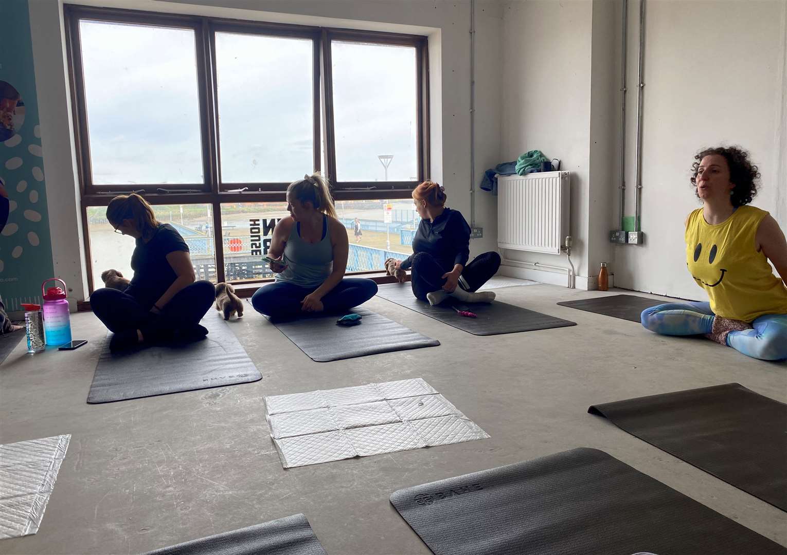 The yoga group was led by Lucy McDonald (seen in yellow)