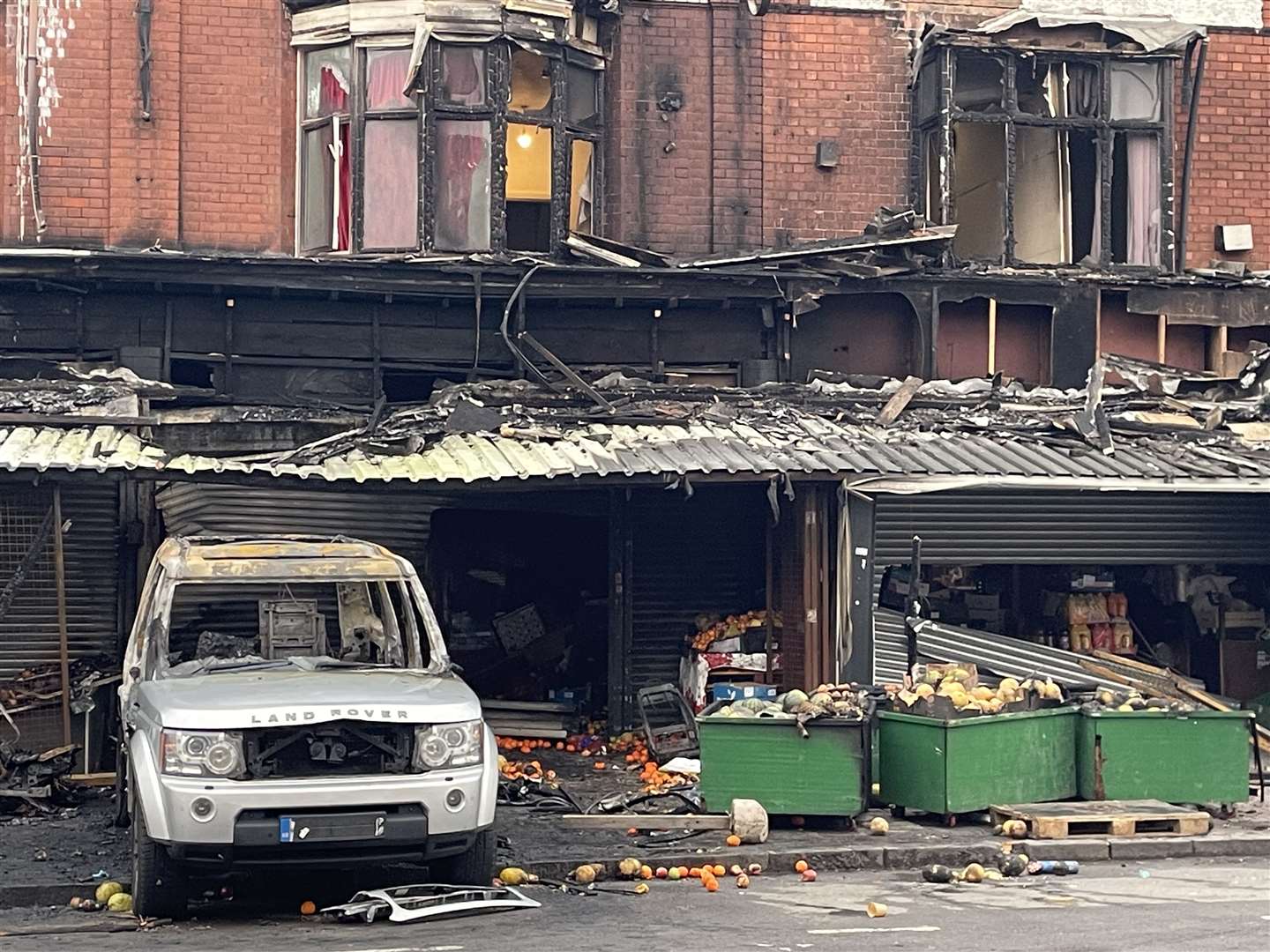 The remains of a burnt-out car at the scene of the fire (Matthew Cooper/PA)