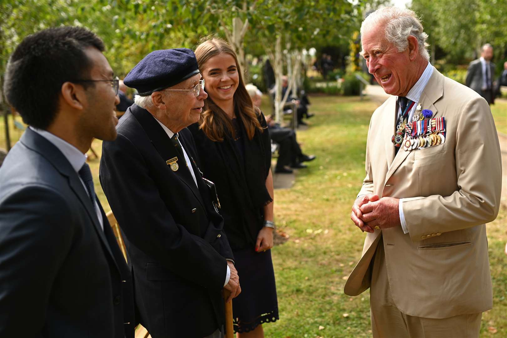 Charles chats to a veteran after the service (Oli Scarff/PA)