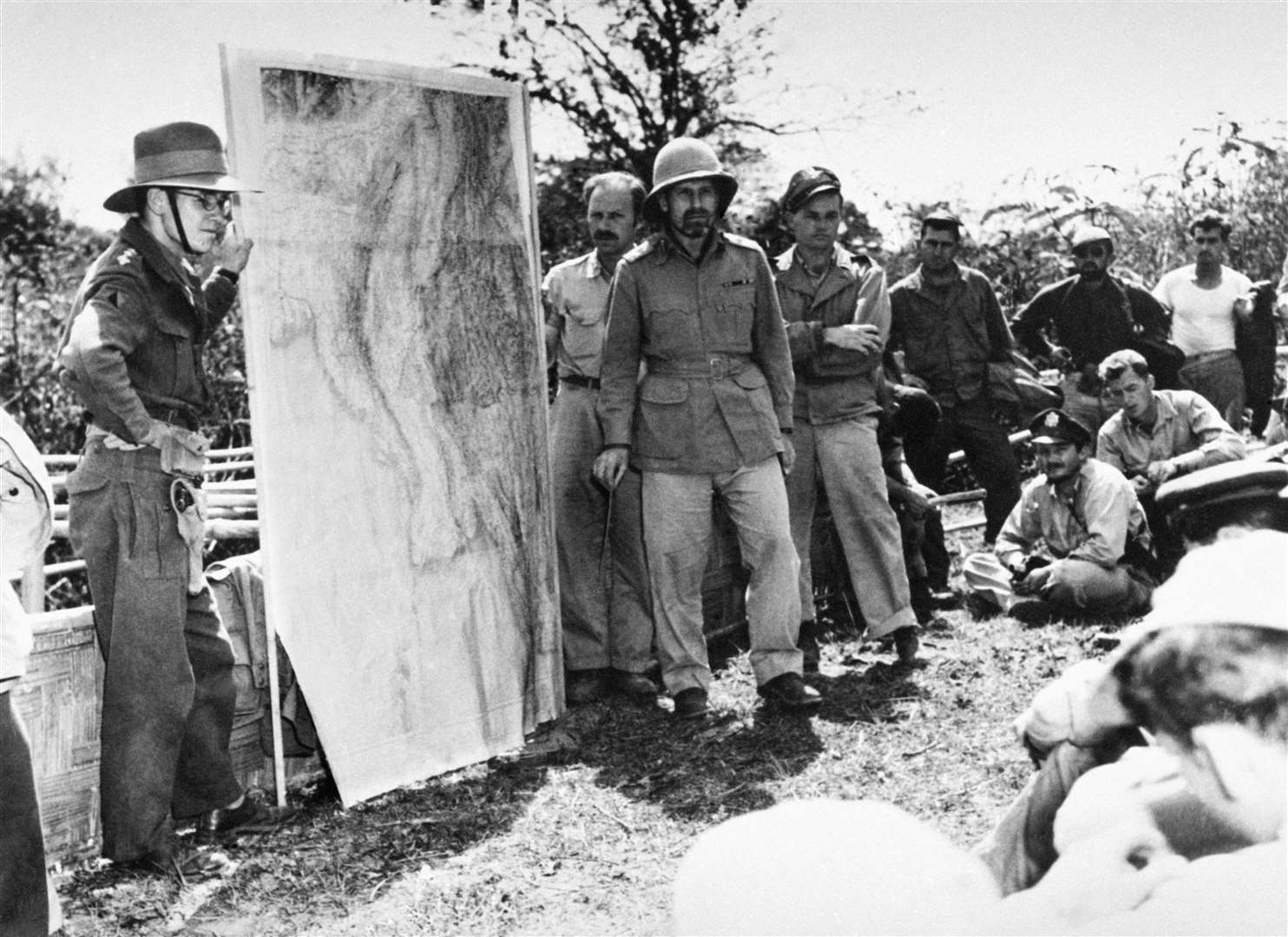 Chindits commander General Orde Wingate (wearing a pith helmet) briefs members of the 1st Air Commando, USAAF, in Burma in 1944 (PA)