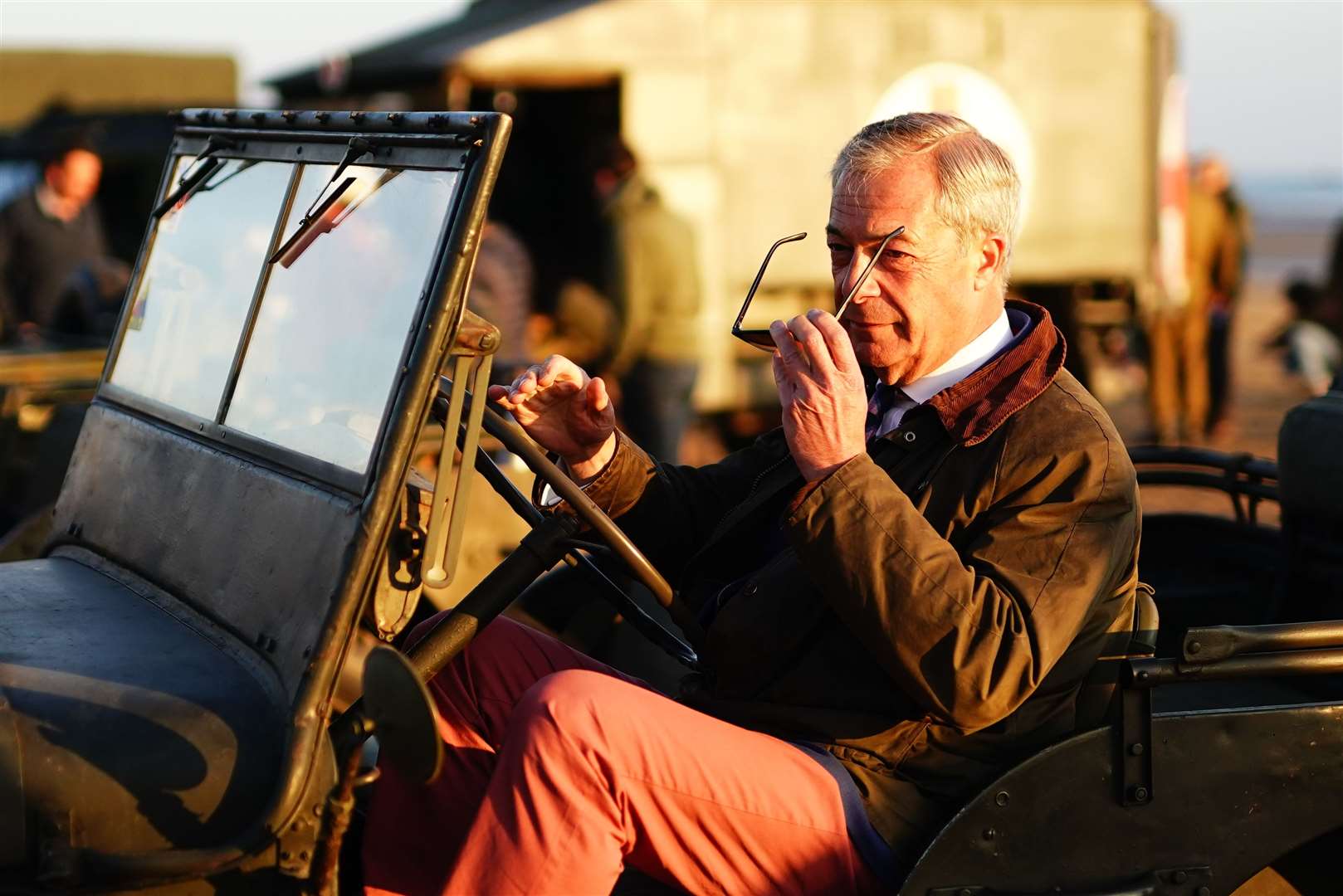 While Rishi Sunak had a D-Day commemoration to forget after being criticised for returning to the UK early on the 80th anniversary of the landings, Mr Farage was on Gold Beach in Arromanches in Normandy driving a vintage jeep as dawn broke on June 6 (Aaron Chown/PA)