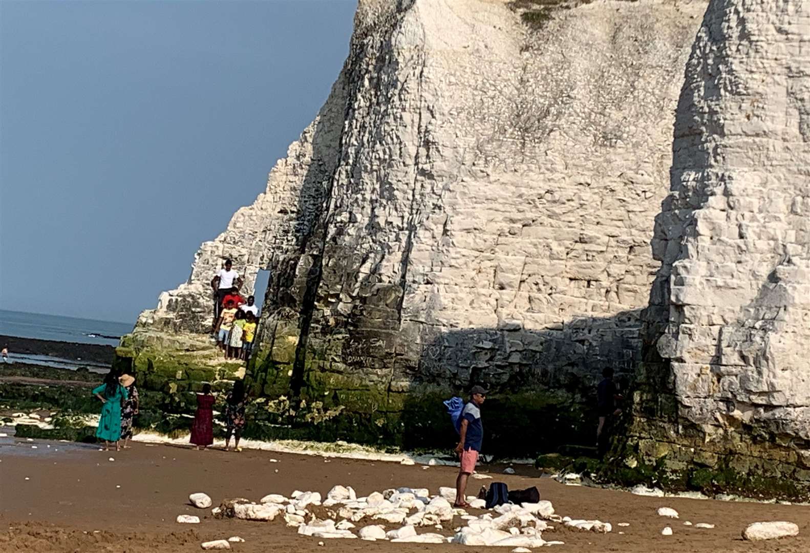 A family climbing on the stack to snap a picture