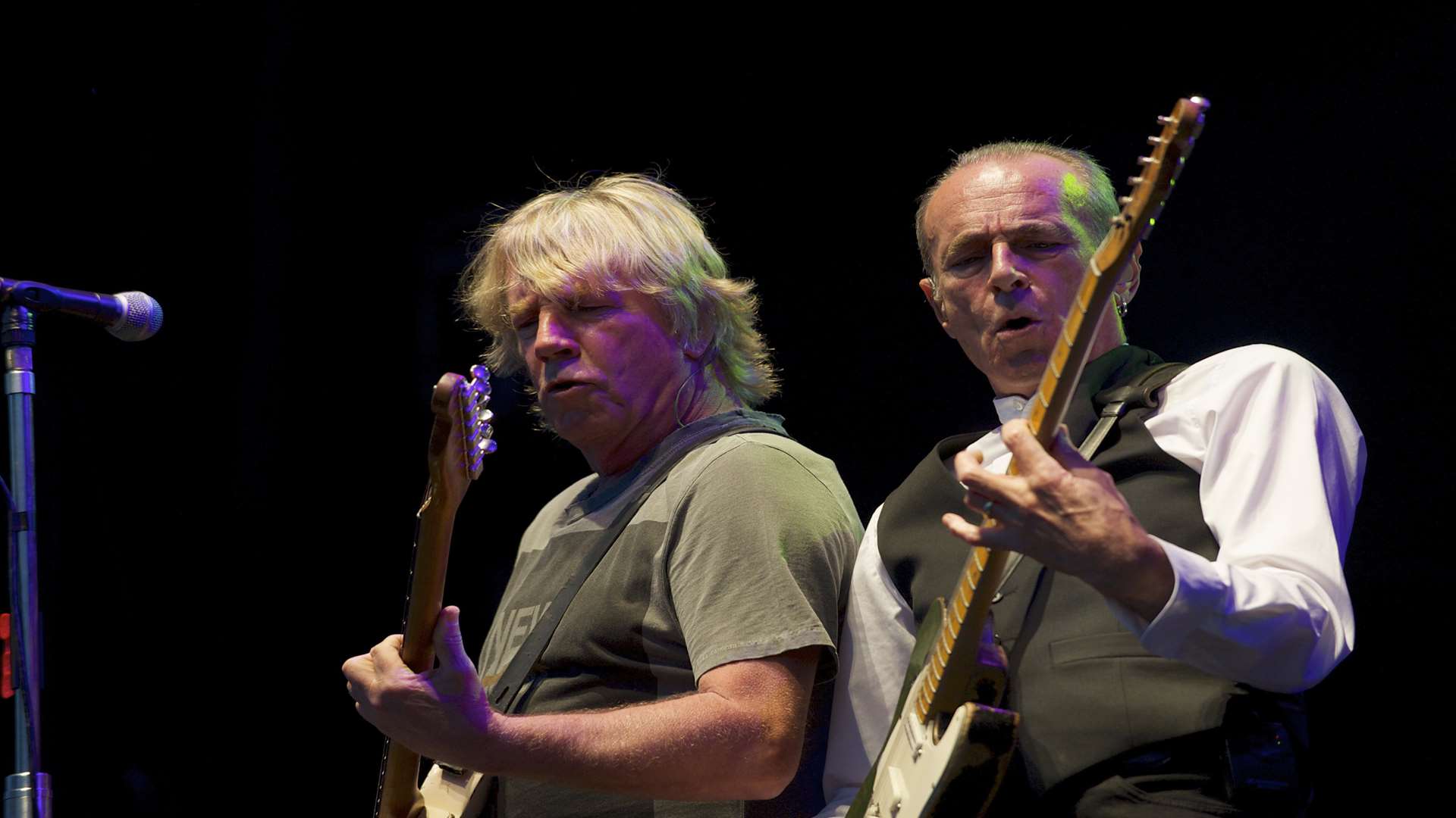 Rick Parfitt, left, and Francis Rossi. Status Quo play the first night at the Rochester Castle Concerts 2013