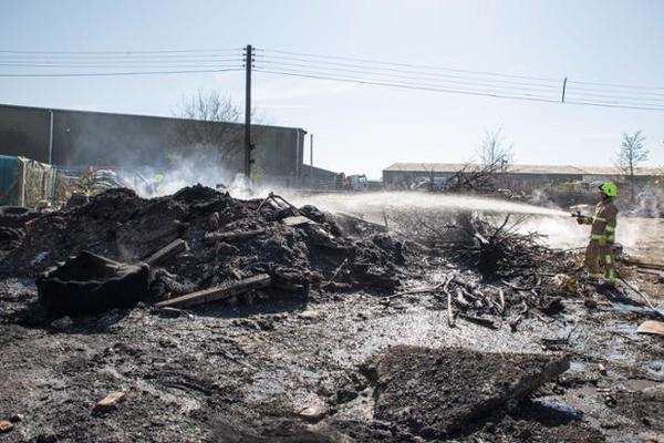 Firefighters damping down the scene at Detling. Picture: Kent Fire and Rescue