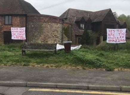 There are signs for and against a KFC in Snodland. Credit: Katie Rose