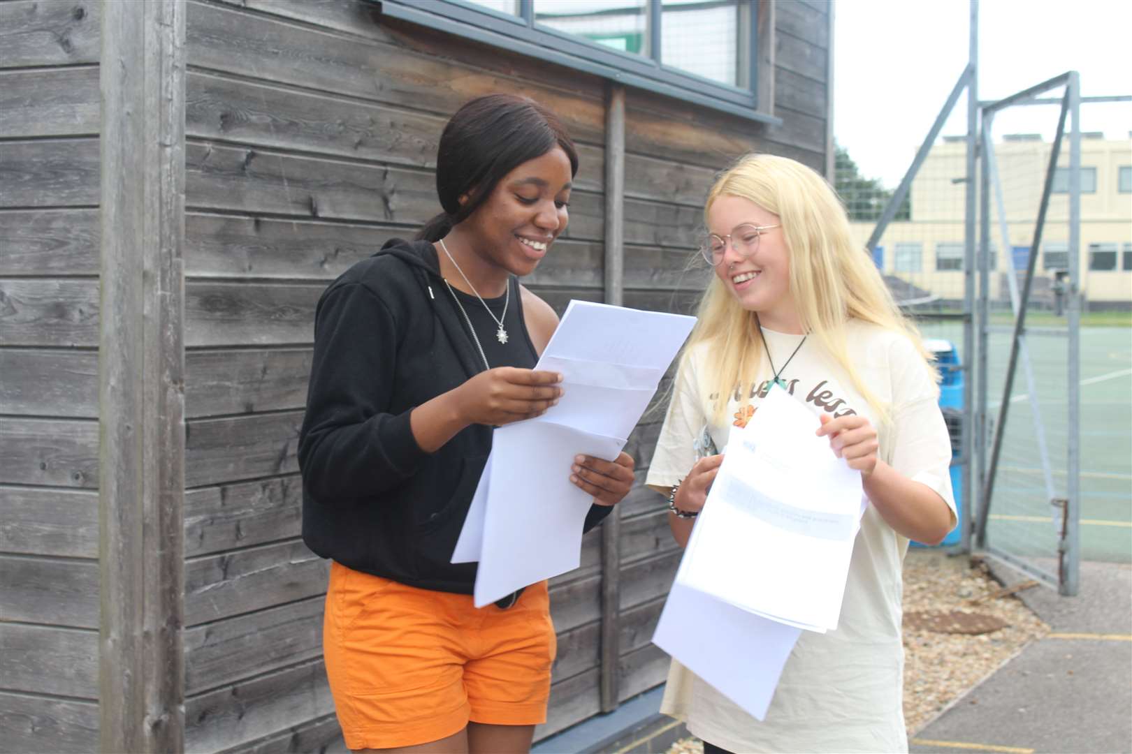 Pupils from Sittingbourne's Highsted Grammar School for Girls compare GCSE results on Thursday