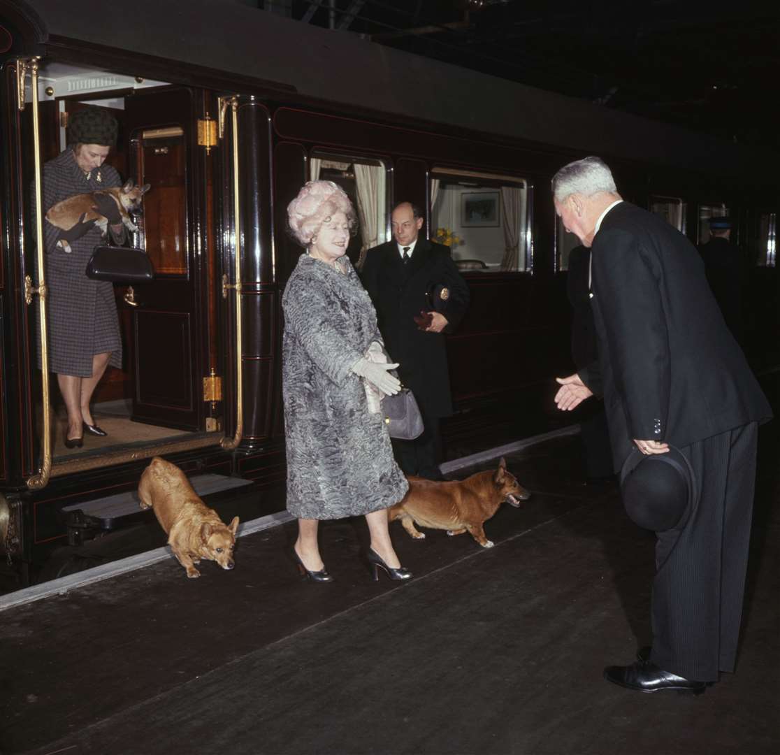 The Queen Mother, with her corgis, arriving at Liverpool Street Station from Sandringham in 1966 (PA)