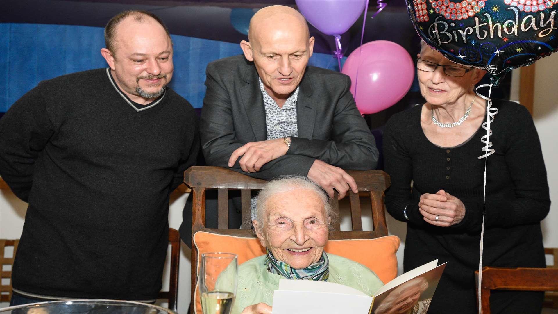 Centenarian Yvonne Goede with her card from the Queen.