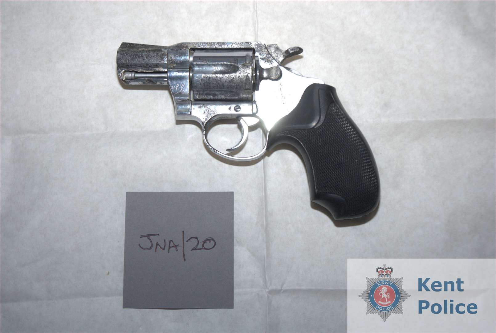 Officers found four loaded weapons in a safe in the basement. Pictures: Kent Police