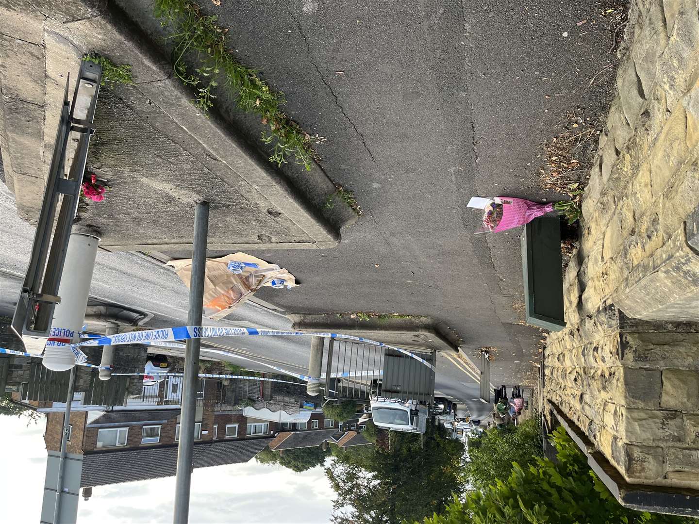 Tributes have been left outside the school (Katie Dickinson/PA)