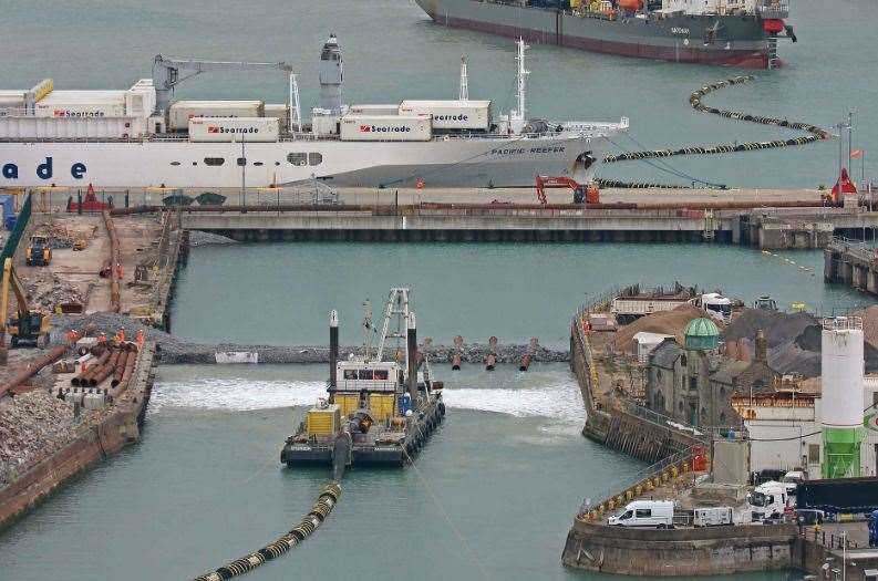 The yellow-backed vessel, Steenbok, is one of the craft used for the start of the infilling work at Dover Western Docks to make space for the EES border checks. Picture: Dover Strait Shipping - FotoFlite