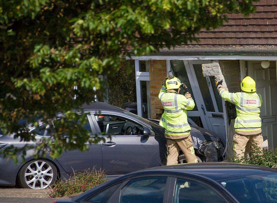 Firefighters tried to make the damaged wall safe. Picture: Mel Butcher